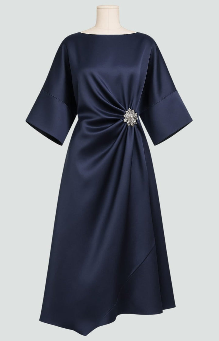 Full-length shot of the Heather elegant dress in Khaki with a soft, sophisticated finish