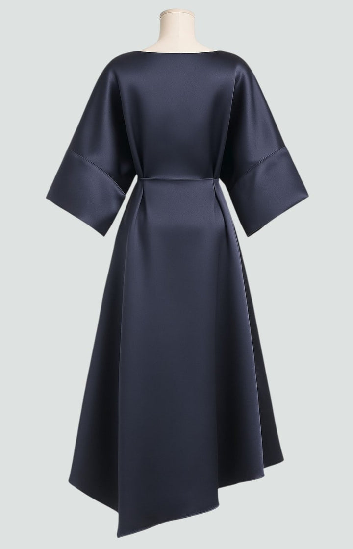 Styled flat lay or detail shot of the Heather long dress showcasing color and fabric texture