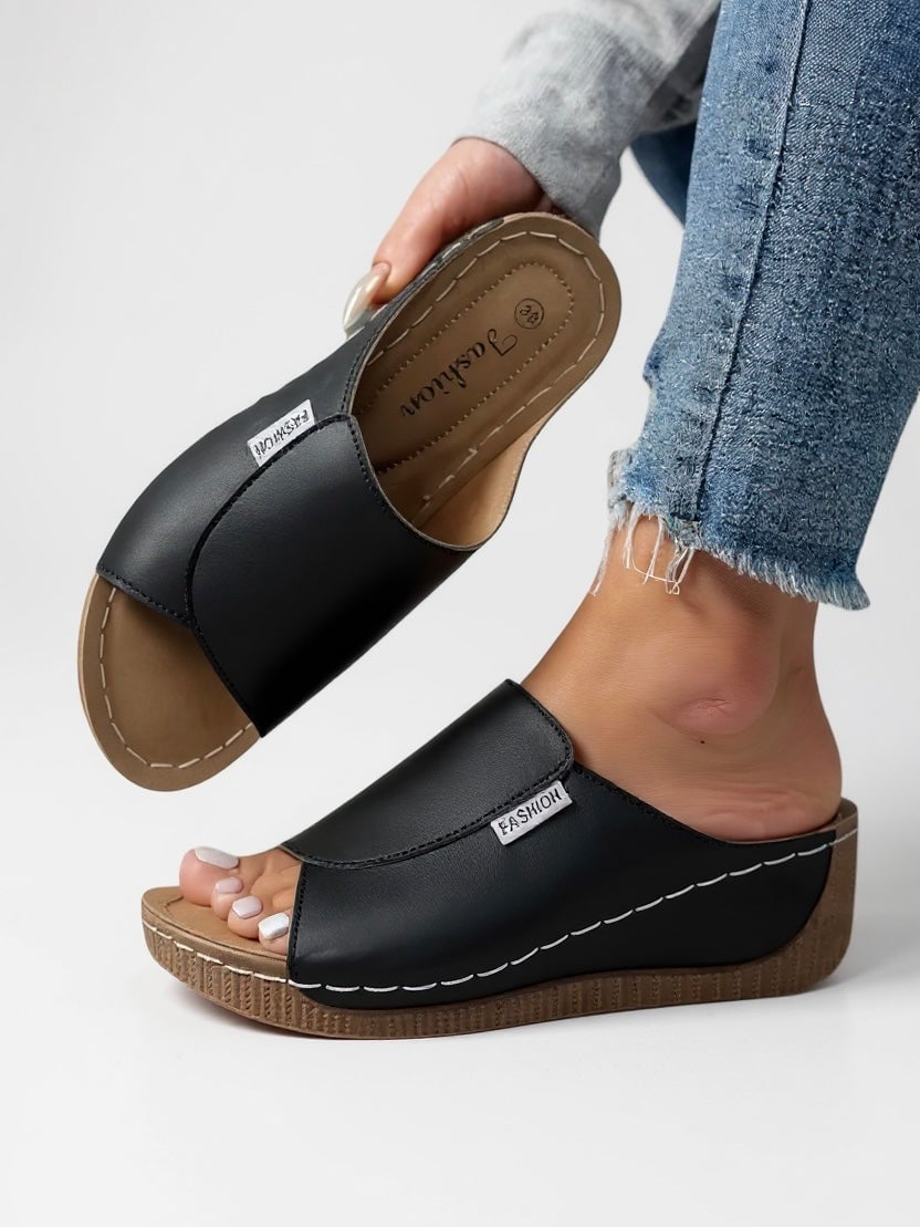 Heather women's platform cushioned slides in white, side view showing lightweight platform sole and contoured footbed