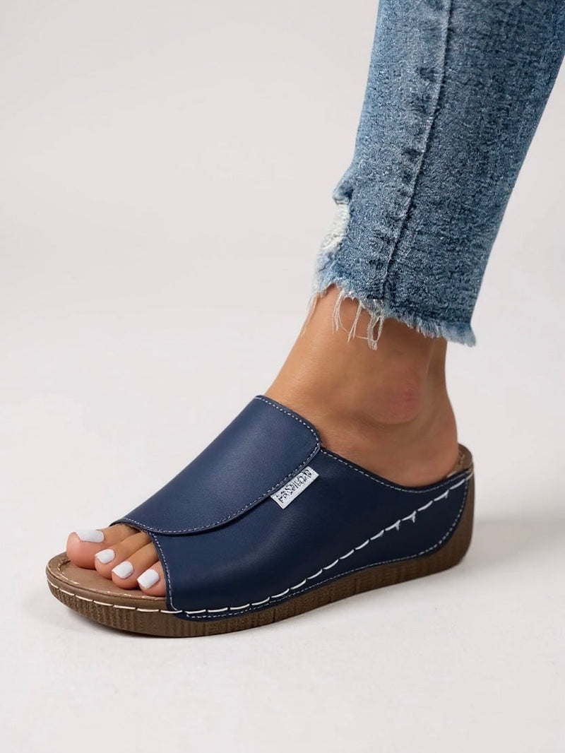 Heather platform cushioned slides in black, top-down view showing clean strap and footbed detail