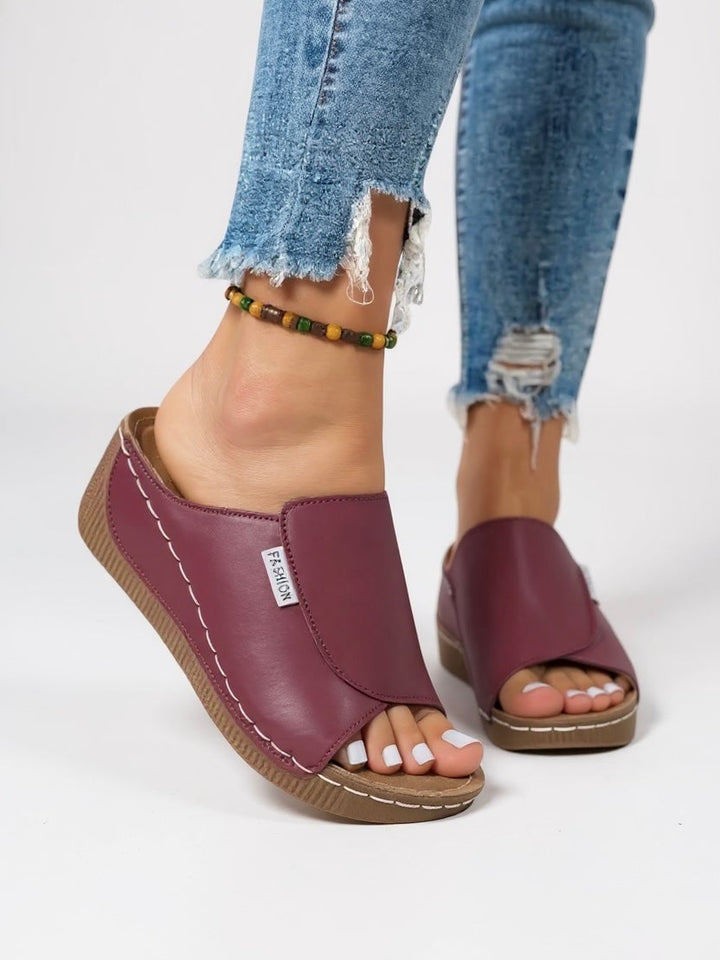 Heather platform slides in light blue, styled with a casual summer outfit