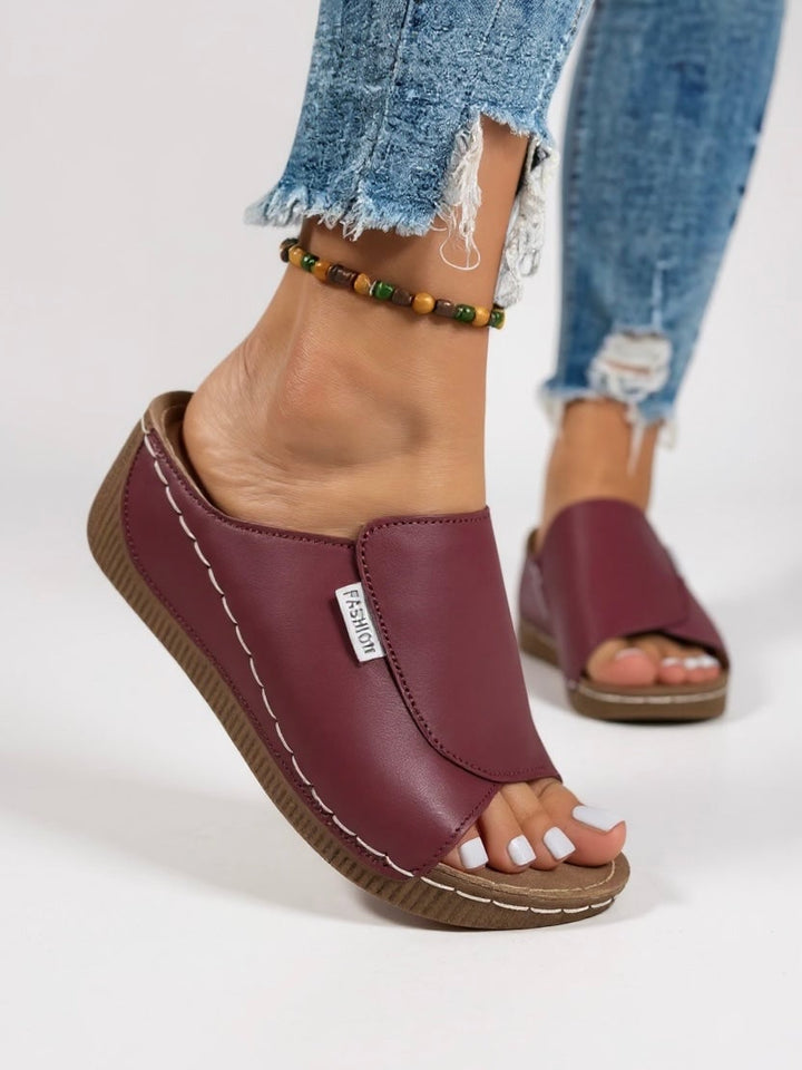 Close-up of the cushioned contoured footbed on the Heather platform slides