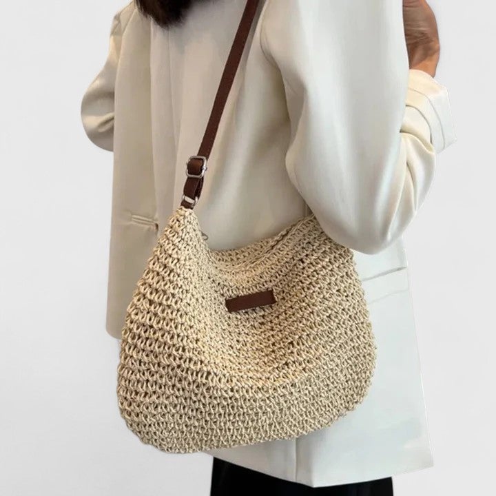 Hedda shoulder bag in beige styled with a summer outfit on a city street