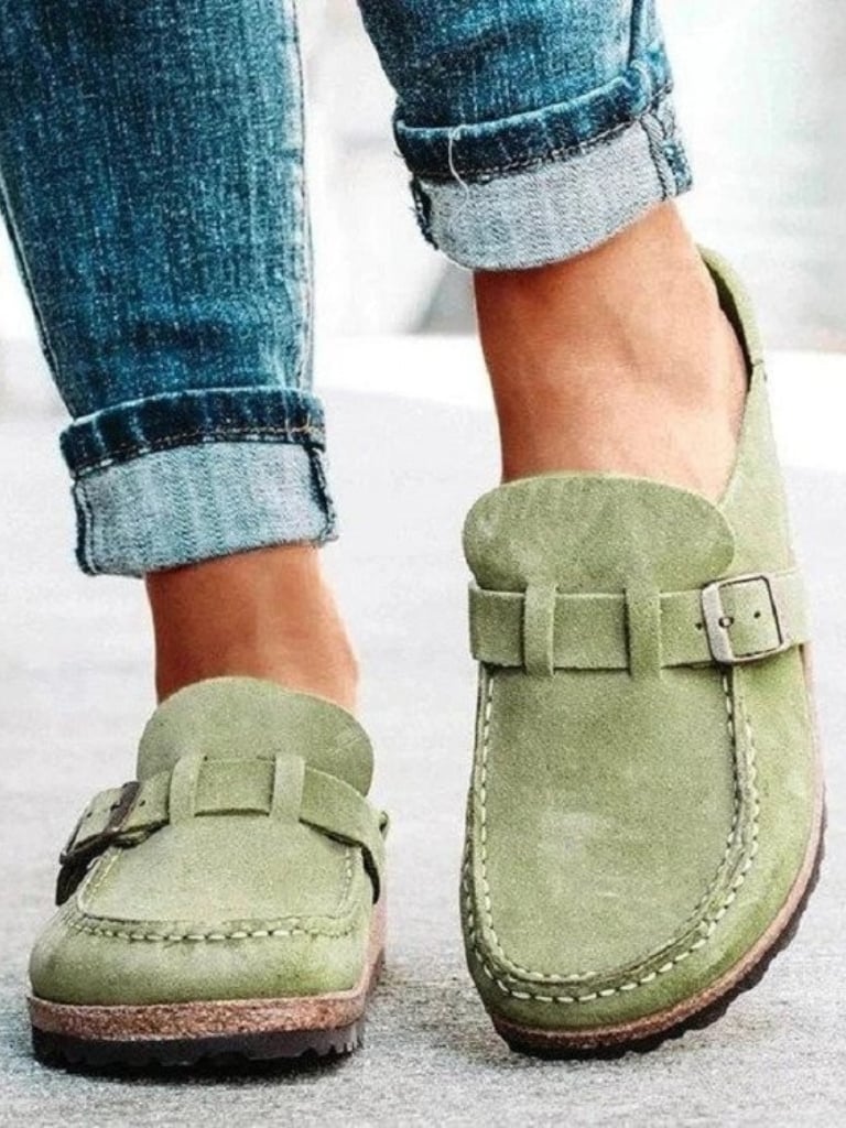 Helen comfort clogs in sage green shown from the side, highlighting the cushioned footbed and slip-on silhouette