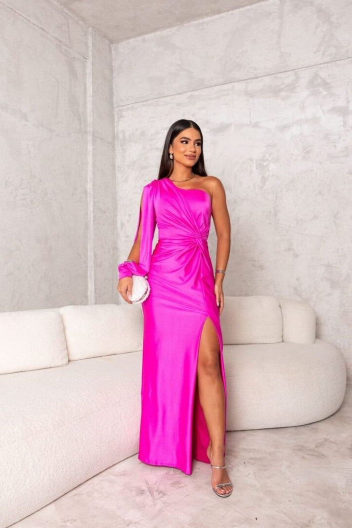 Model posing in the one-shoulder maxi dress in green, showing relaxed drape