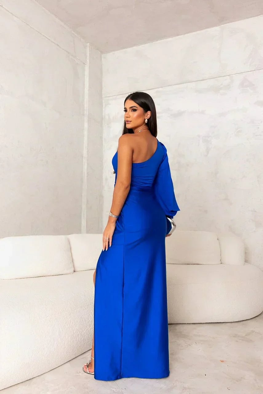 One-shoulder maxi dress in turquoise displayed on a model in a formal setting