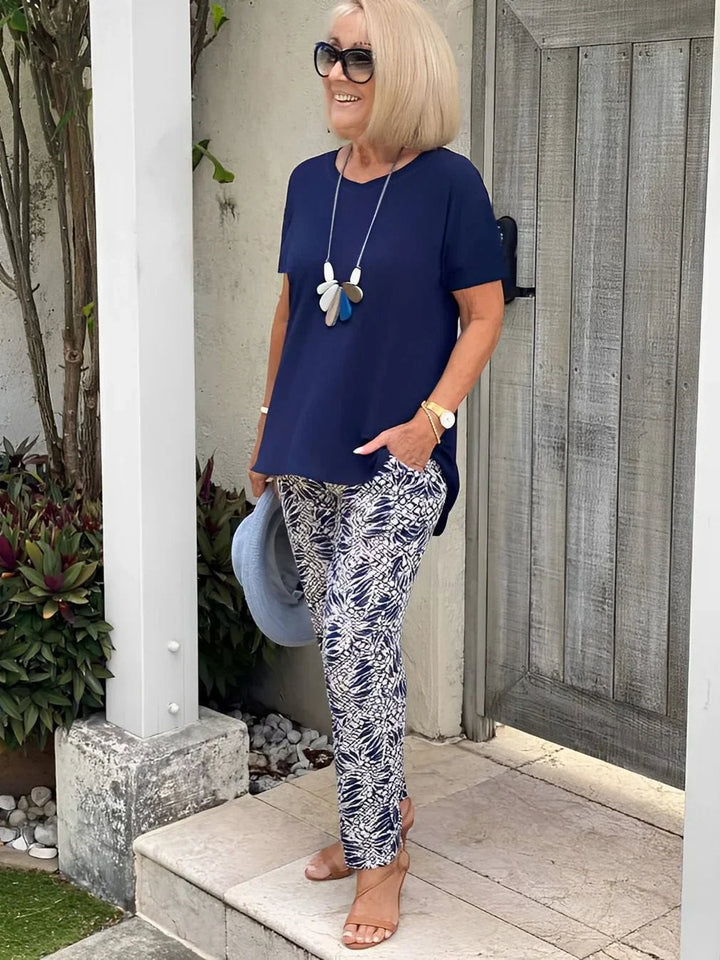 Close-up front view of the Florimay Coastal Set wide-leg pants and blouse in blue, showing contrast pattern detail and flowing silhouette