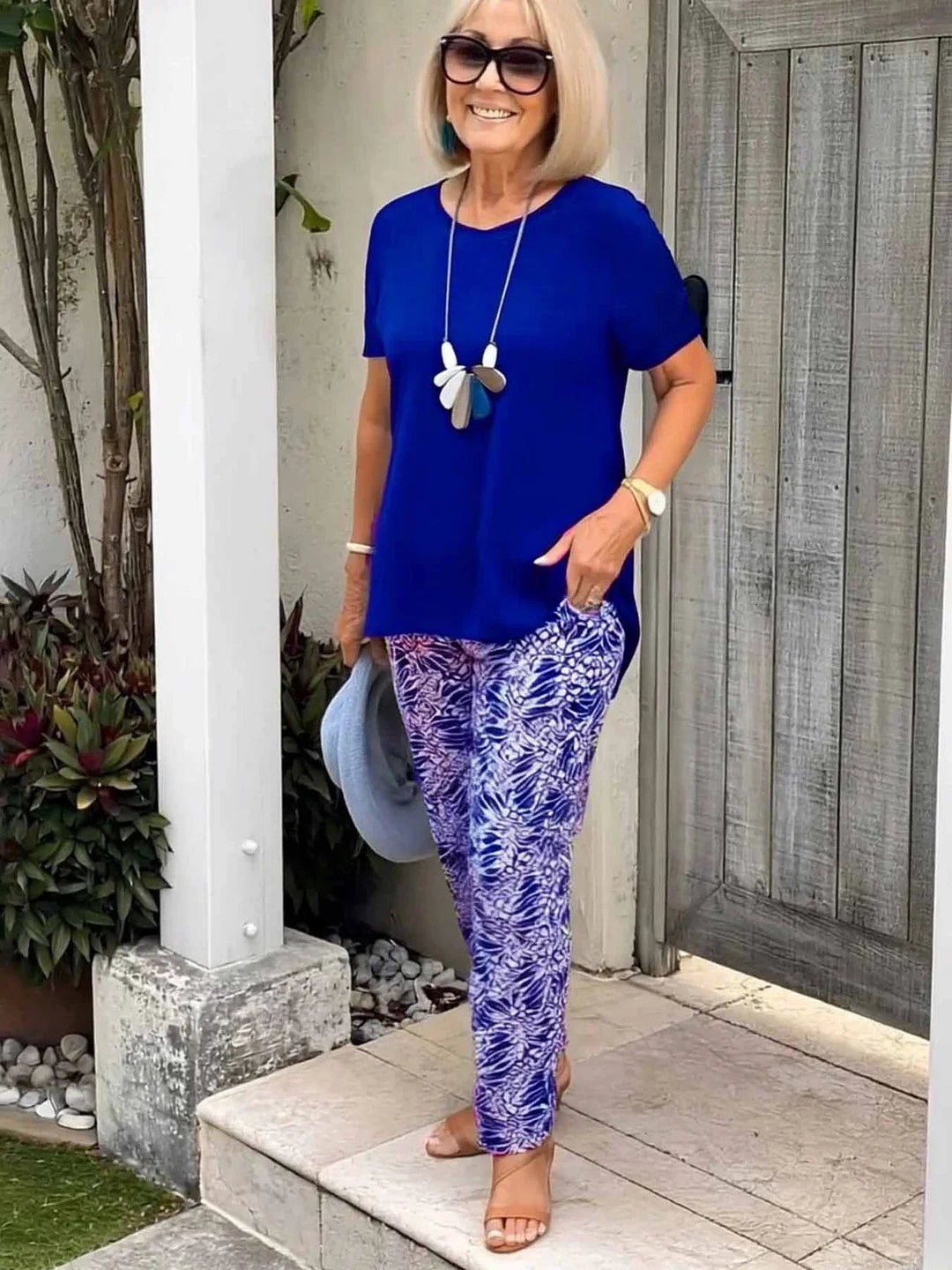 Detail shot of the artistic pattern on the Florimay Coastal Set blouse in blue