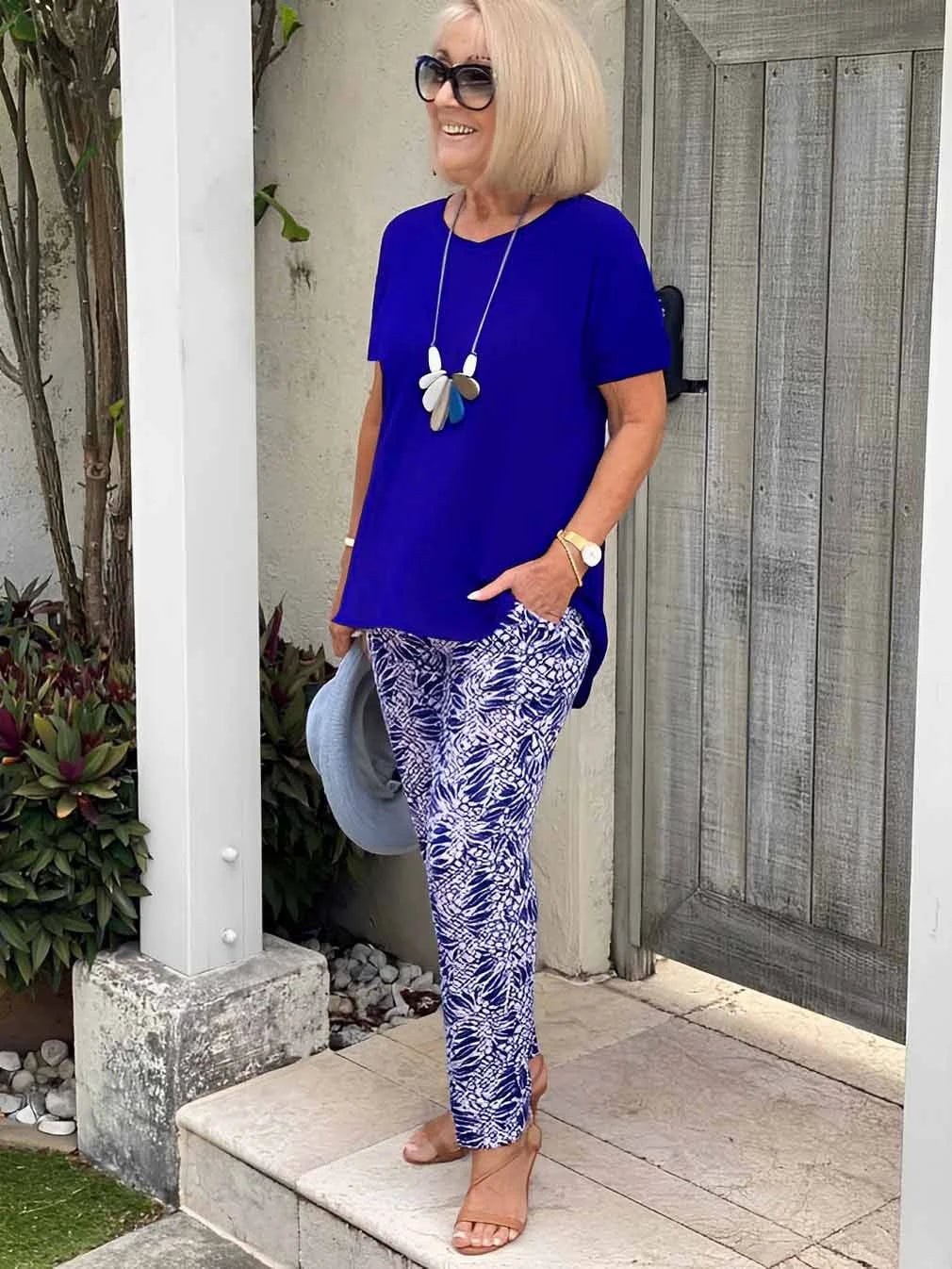 Woman smiling in the Florimay Coastal Set in navy blue, styled for a casual outdoor occasion