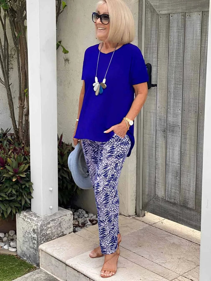 Woman smiling in the Florimay Coastal Set in navy blue, styled for a casual outdoor occasion