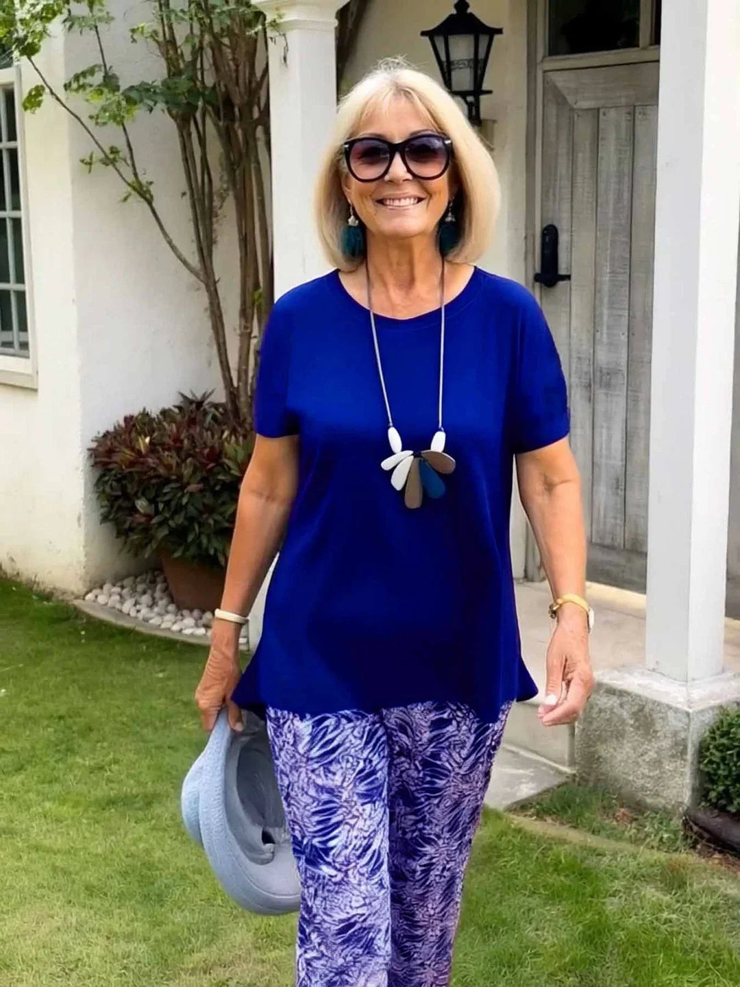 Flat lay of the Florimay Coastal Set blouse and wide-leg pants in blue showing the complete two-piece ensemble