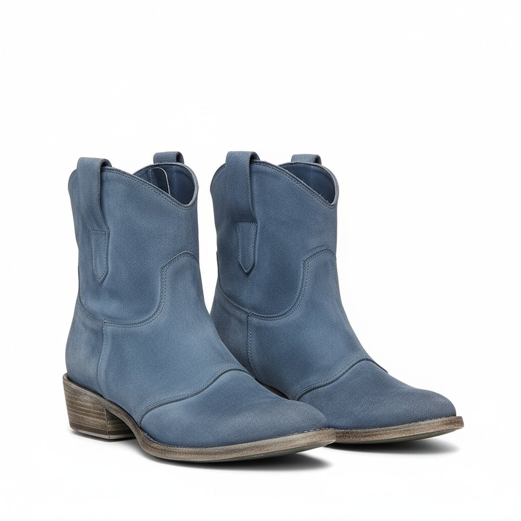 Henny vintage ankle boots in black styled with denim jeans, front-facing view