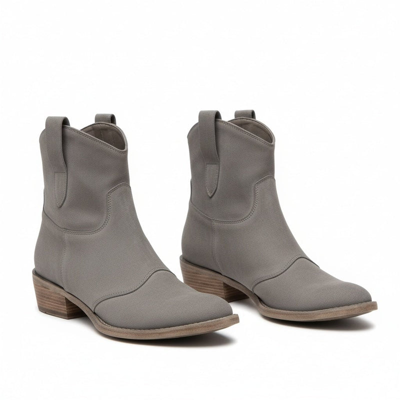Henny cowboy ankle boots in pink shown from a three-quarter angle highlighting the sculpted silhouette