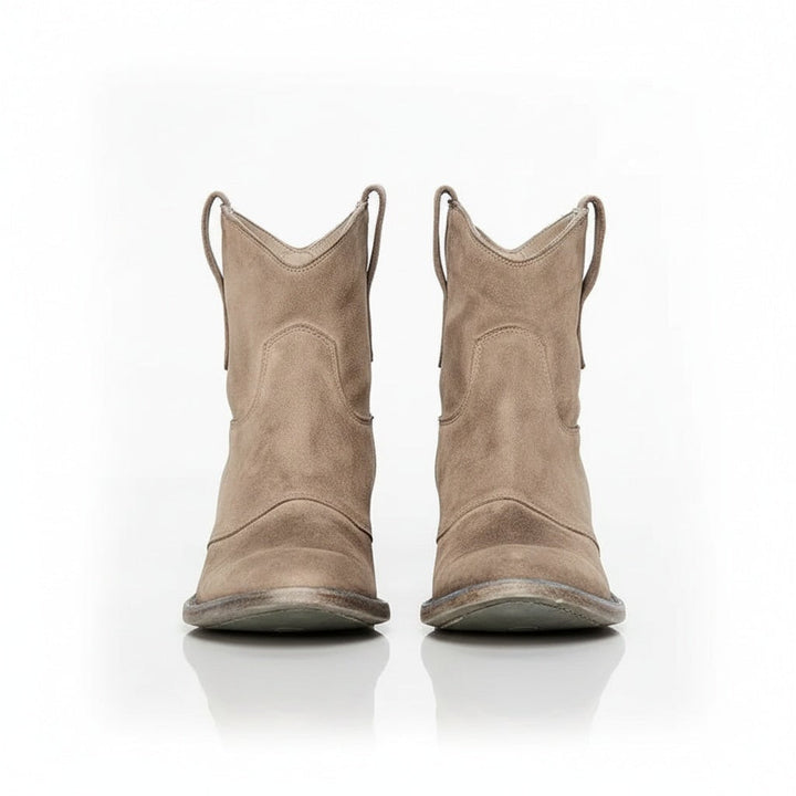 Henny cowboy ankle boots in blue styled with a flowy skirt for a boho Western look