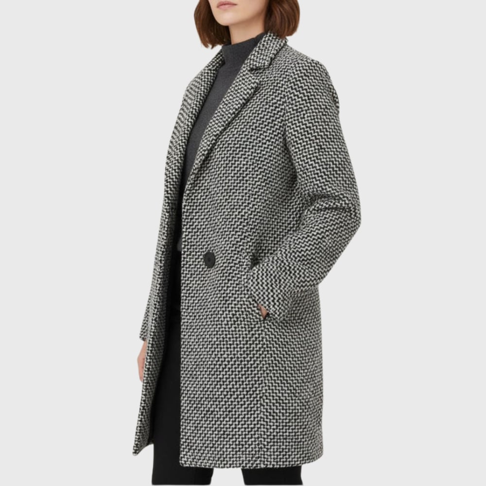 Side view of the Herlie warm winter coat in grey demonstrating the streamlined fit and sleeve length