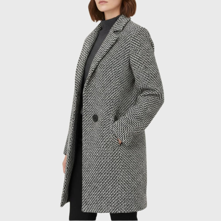 Side view of the Herlie warm winter coat in grey demonstrating the streamlined fit and sleeve length