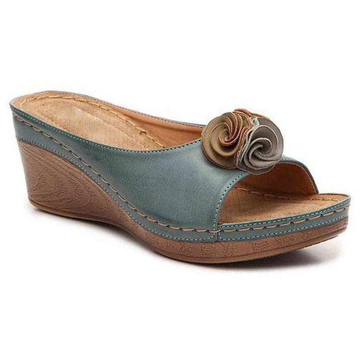 Heron orthopedic wedge sandals in pink displayed on a neutral background, three-quarter view