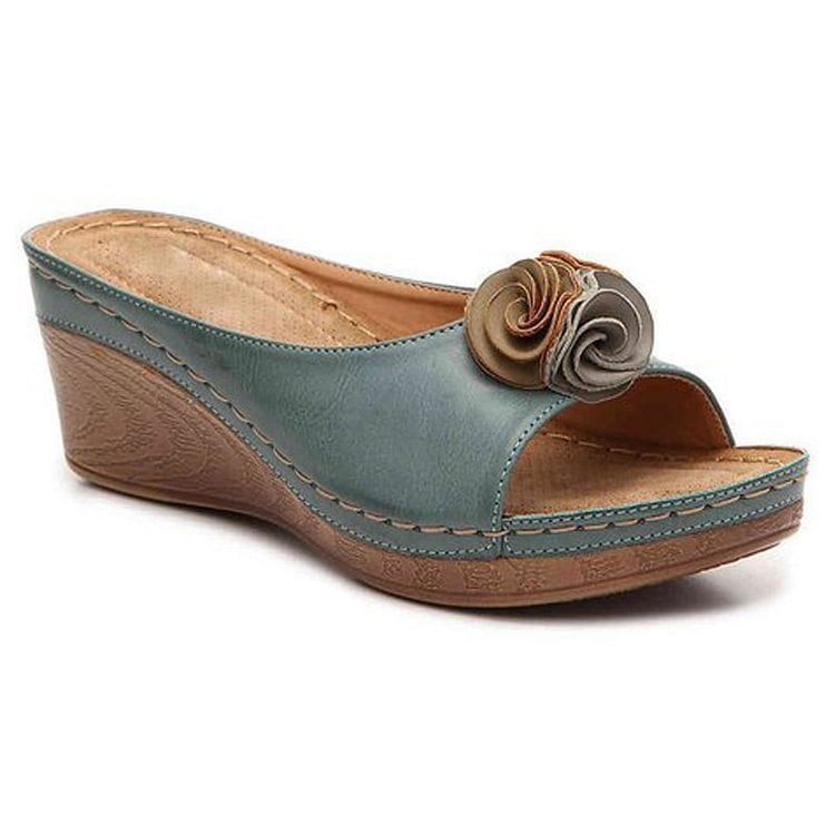 Heron orthopedic wedge sandals in pink displayed on a neutral background, three-quarter view