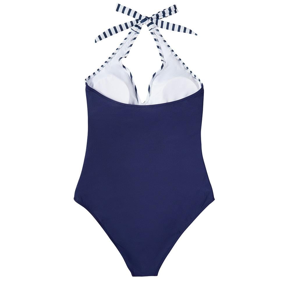 Hilda black one-piece swimsuit styled with a relaxed beach look