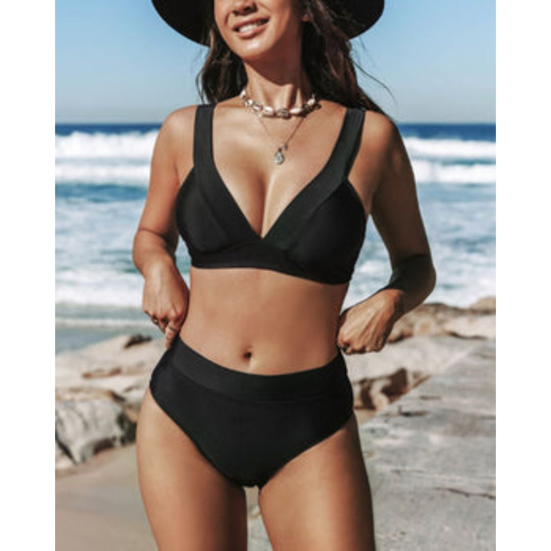 Flat lay of a solid olive high-waist one-piece swimsuit on a light background