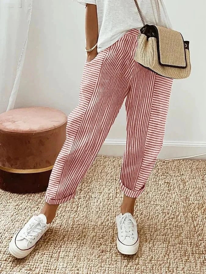 Close-up of striped pants showing straight-leg fit and side pocket detail
