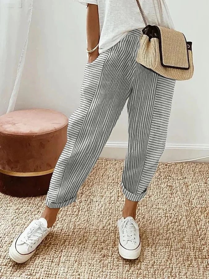 Front view of striped pants highlighting the adjustable drawstring waistband