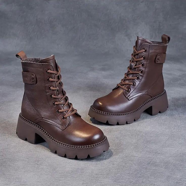 Side profile of Holly orthopedic boots in black showing contoured shape and cushioned sole