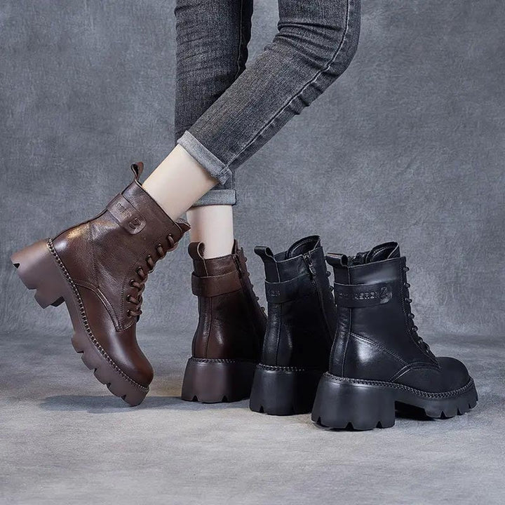 Flat lay of Holly orthopedic boots in both black and brown on a light surface