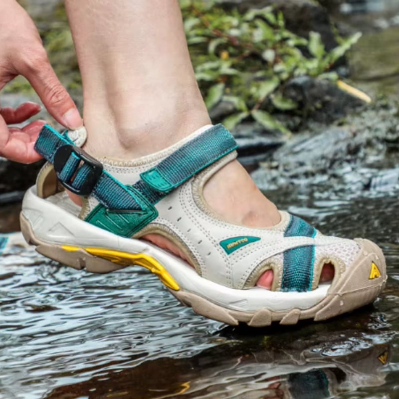 Holly women's adjustable sandals in green, top-down view highlighting strap detail