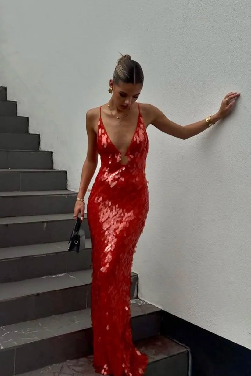Woman wearing a red sequin backless dress with a slim silhouette, front view