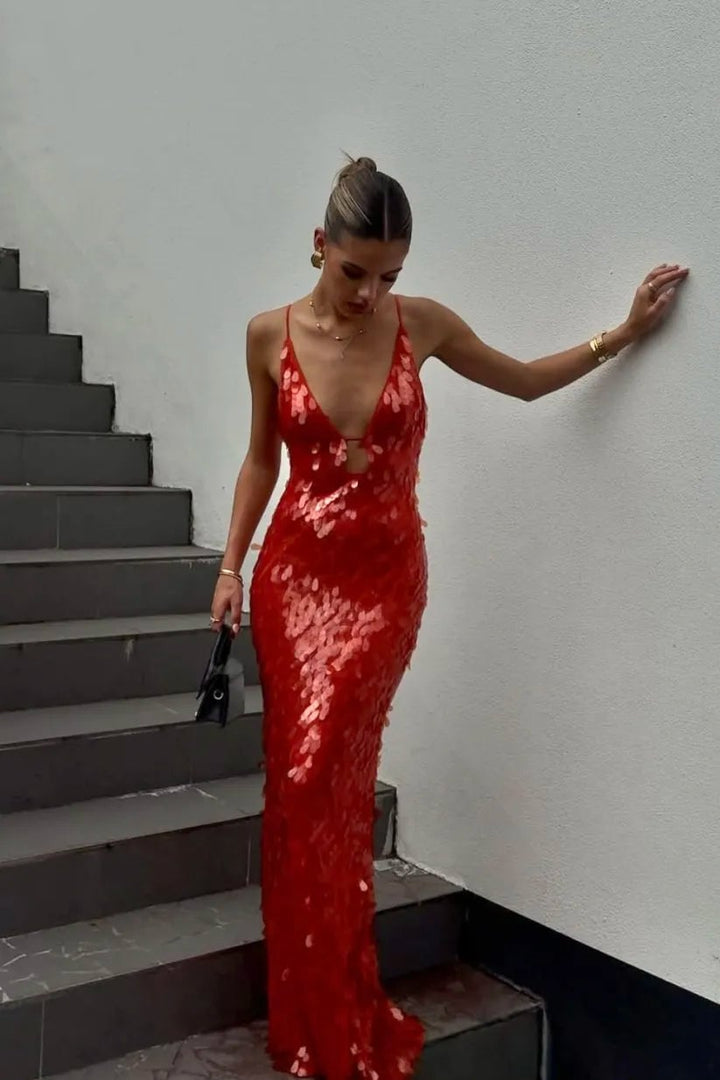 Woman wearing a red sequin backless dress with a slim silhouette, front view