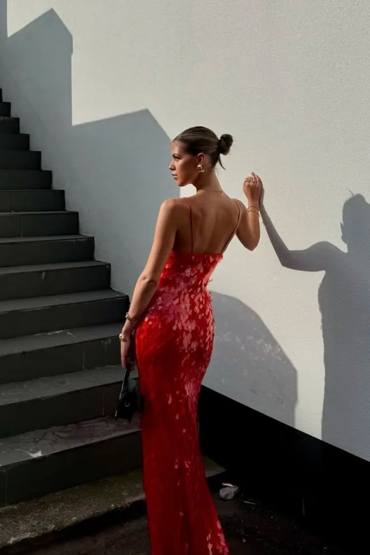 Close-up of the all-over red sequin fabric detail on the Holly backless dress