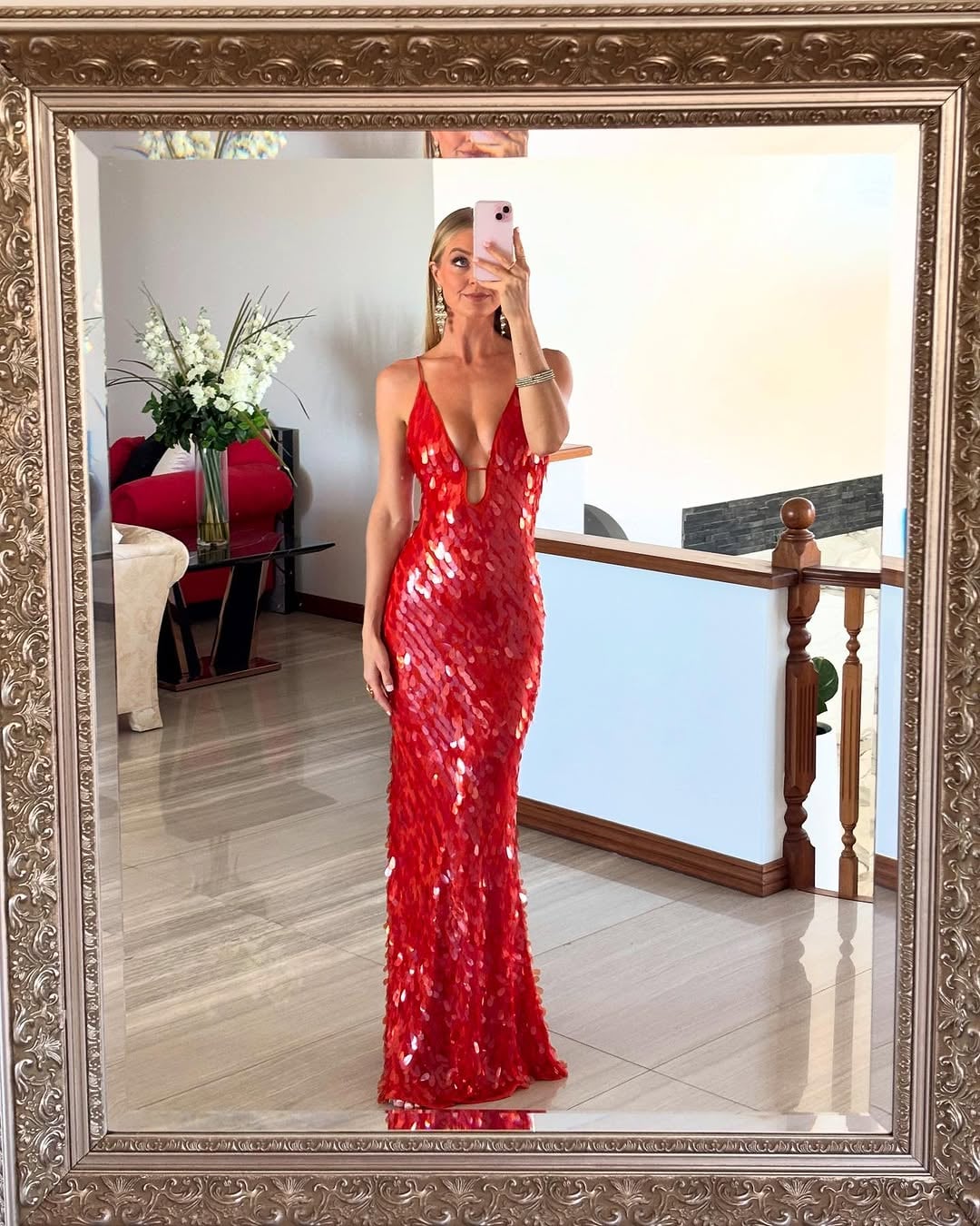 Holly red sequin backless dress displayed on a model from the waist down showing dress length