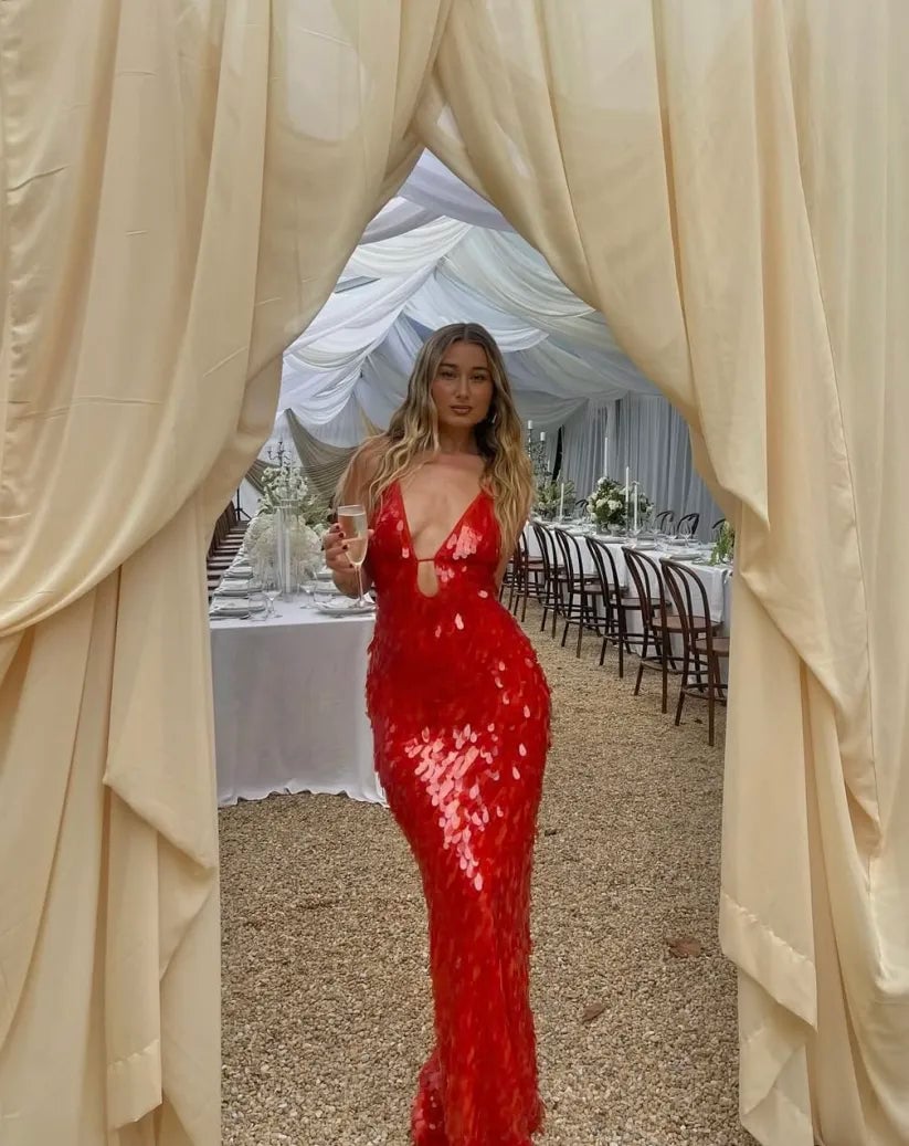 Model wearing the red sequin backless dress paired with heeled sandals, full outfit view