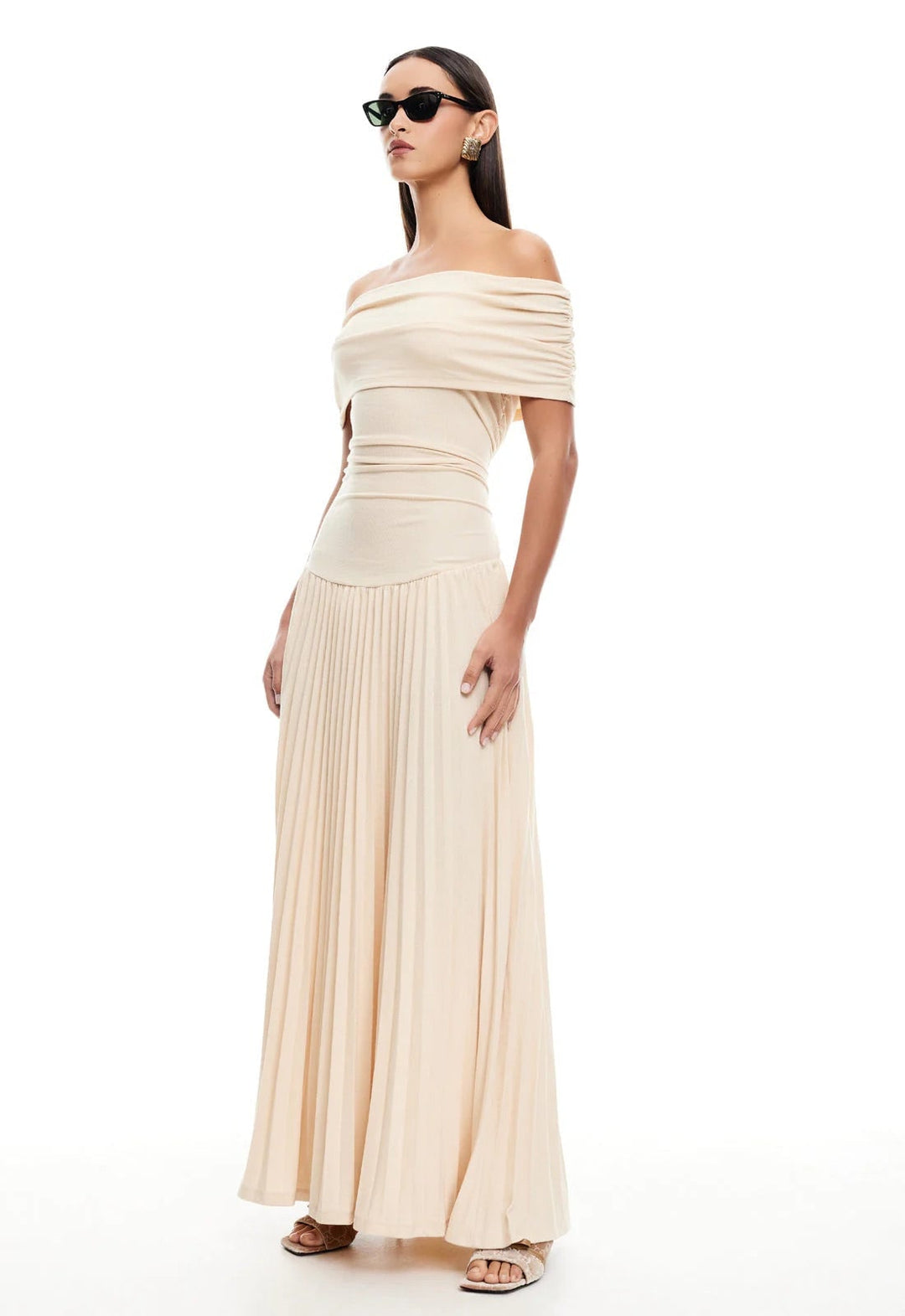 Side profile of a model wearing a sky blue maxi dress, highlighting the flattering full-length silhouette