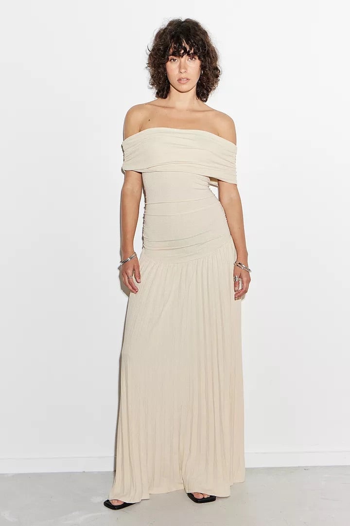 Overhead lifestyle shot of a sky blue maxi dress laid flat, showing fabric quality and relaxed cut