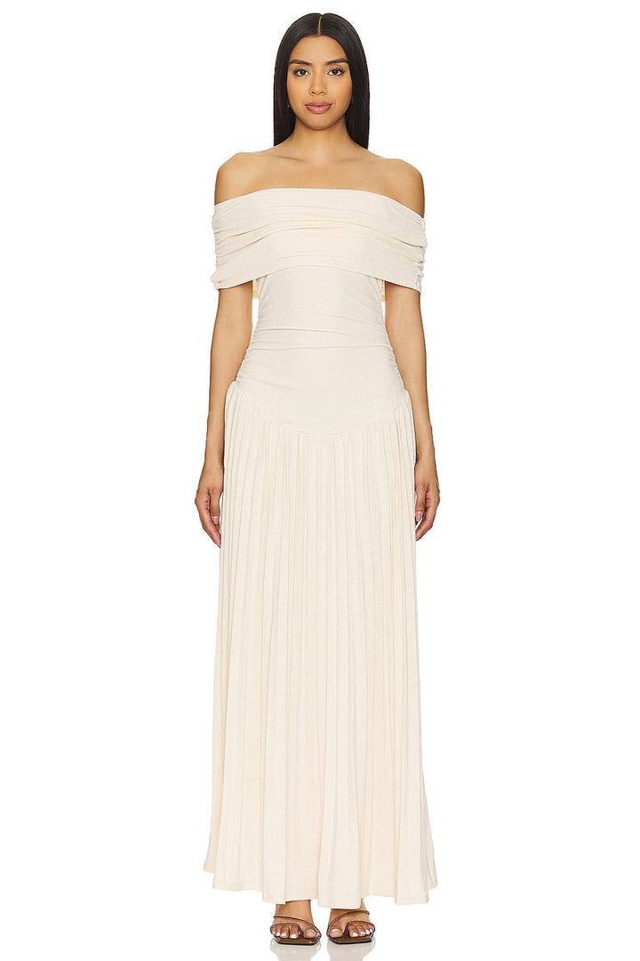 Close-up of sky blue maxi dress waistline and flowing skirt, highlighting the smooth forgiving silhouette