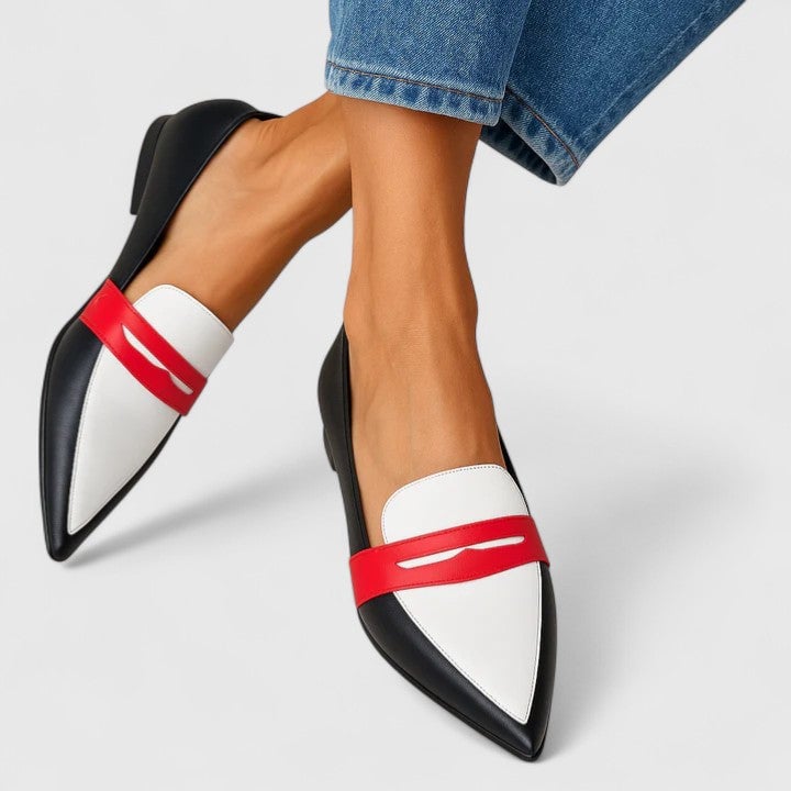 White modern chic women's loafers with a sleek minimalist silhouette and cushioned insole, shown on a clean background