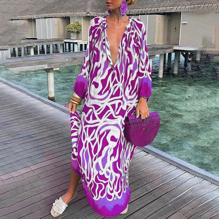 Close-up of vibrant abstract print fabric detail on a loose-fit beach kaftan
