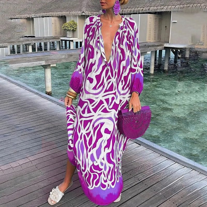 Close-up of vibrant abstract print fabric detail on a loose-fit beach kaftan
