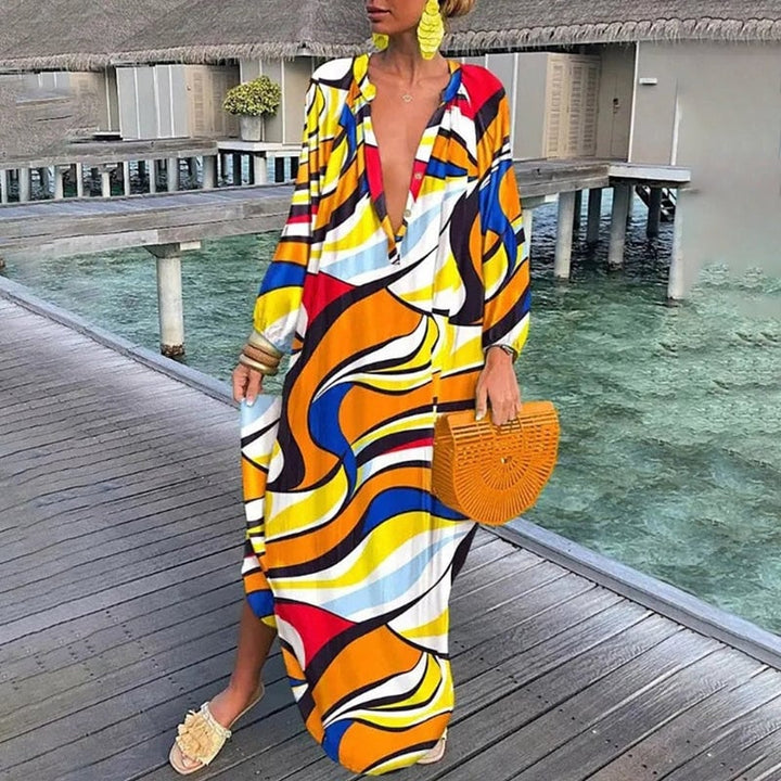 Pink abstract print kaftan worn with sandals for a casual summer look