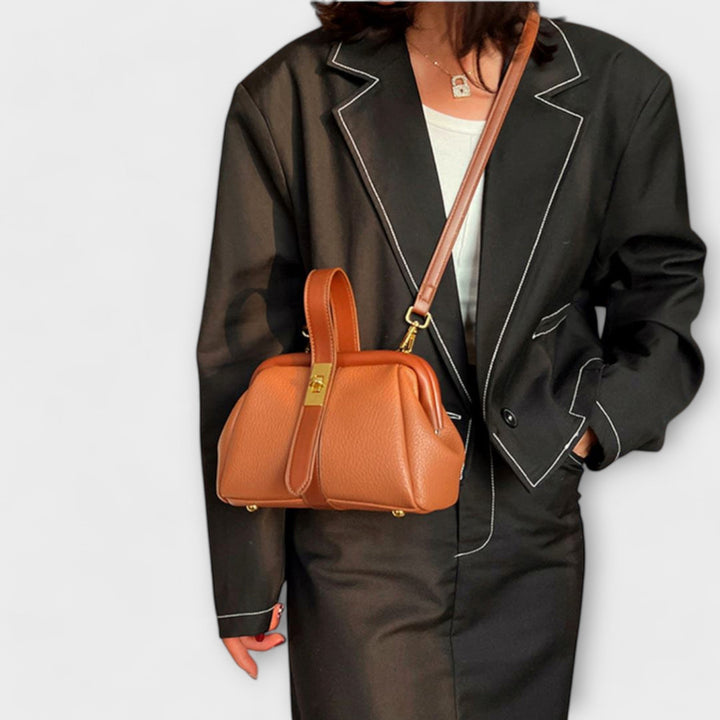 Khaki mini handbag with structured silhouette and golden lock detail