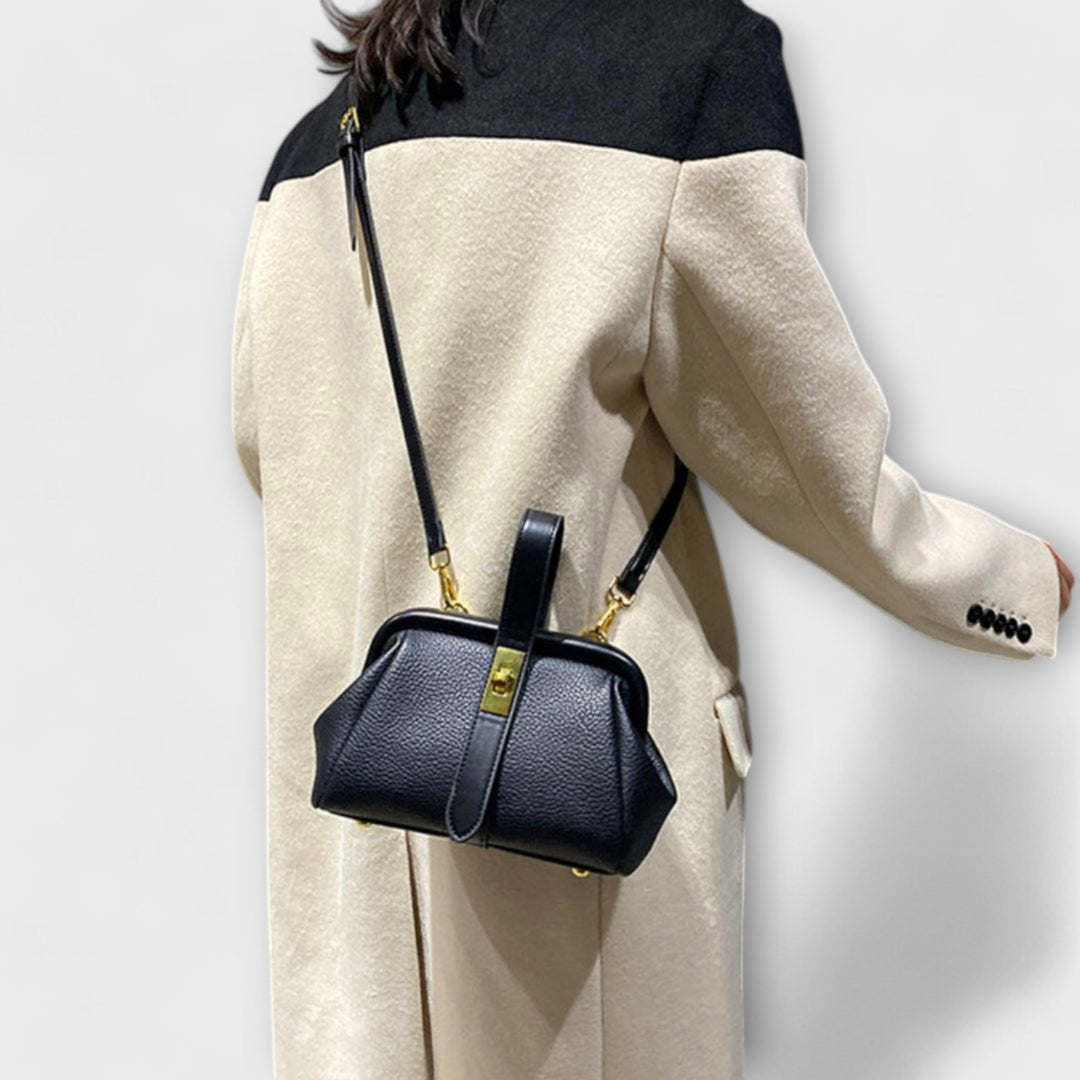 Brown mini handbag interior view showing compact essentials storage