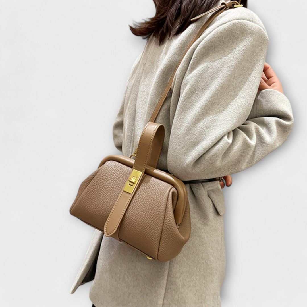 Khaki mini handbag flat lay with neutral fashion accessories