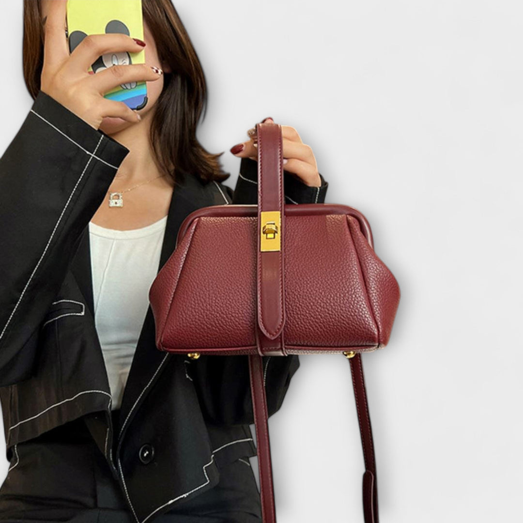 Red mini handbag against a light background highlighting color vibrancy