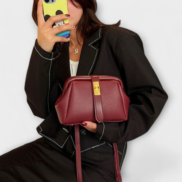 Mini handbag in brown with top handle and removable strap detail