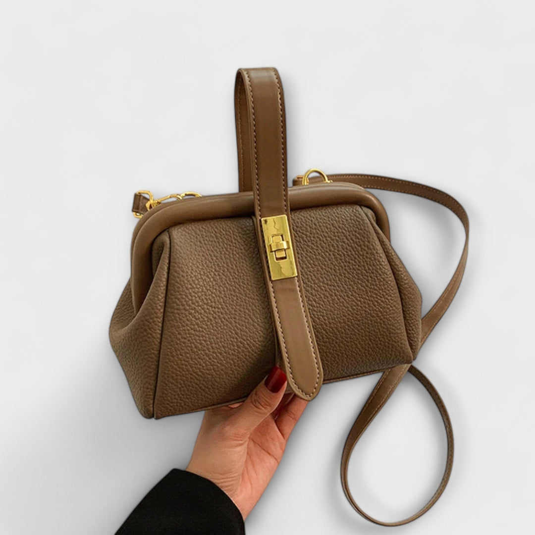 Khaki mini handbag styled with a blazer and tailored pants outfit