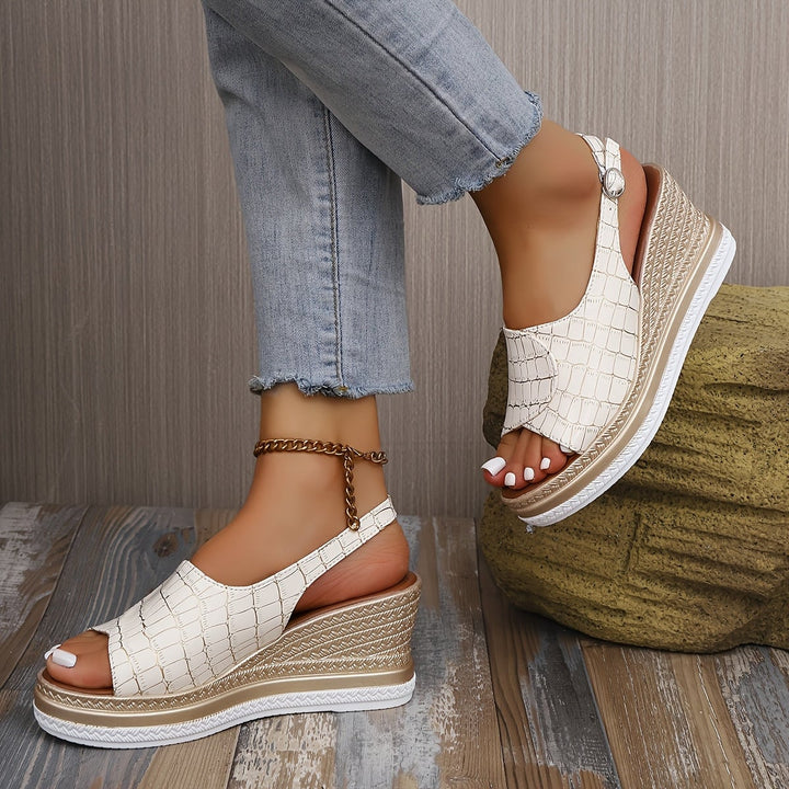 Close-up of the plush insole and elegant strap detail on the Imara white wedge sandals