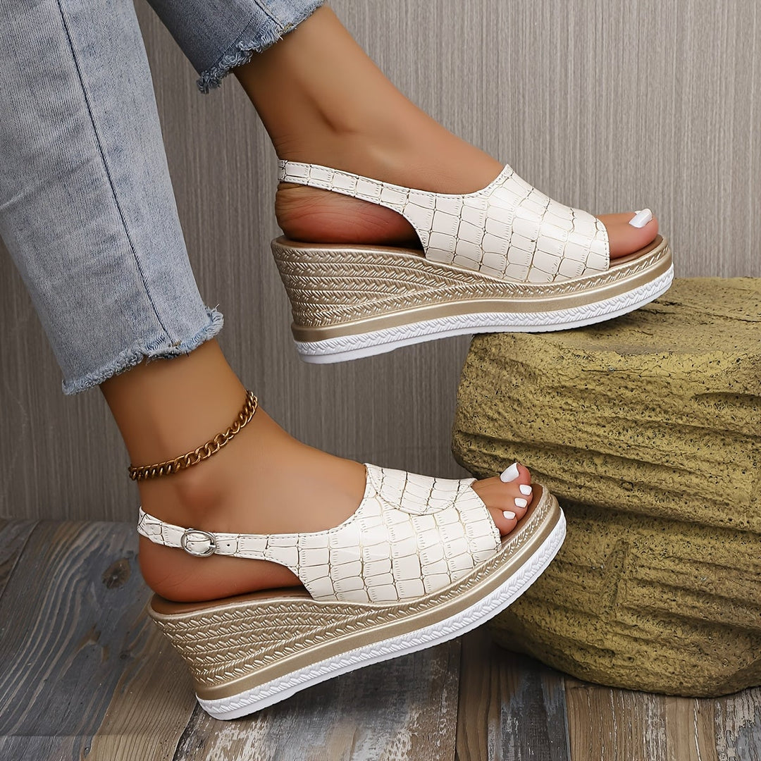 Imara women's wedge sandals in white displayed on a clean light background, angled view