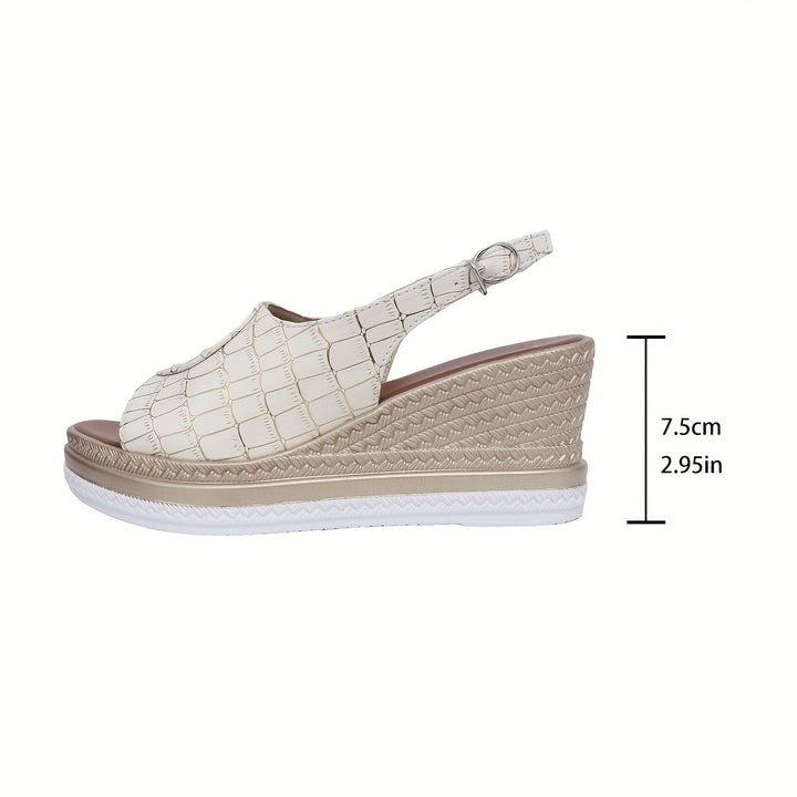 Pair of Imara white wedge sandals laid flat showing full sole and silhouette